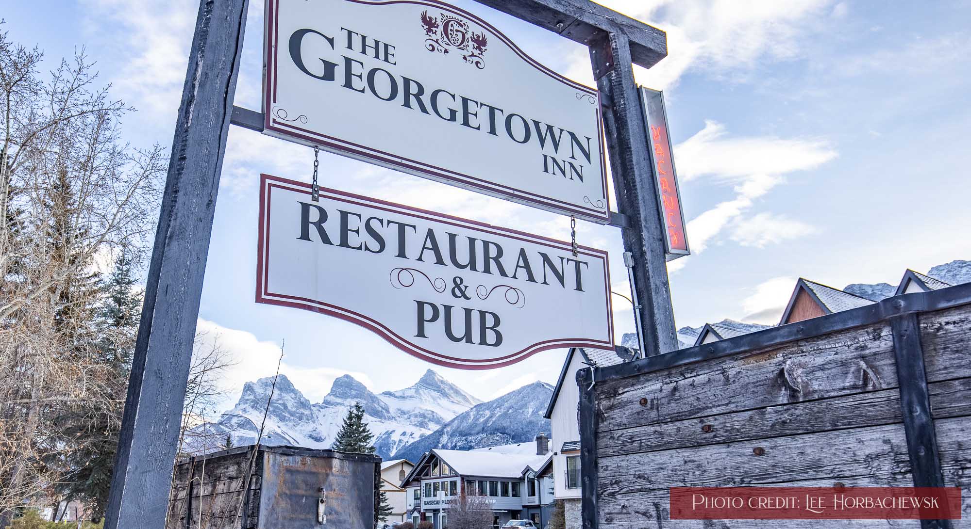 The Georgetown Inn's exterior sign in winter.